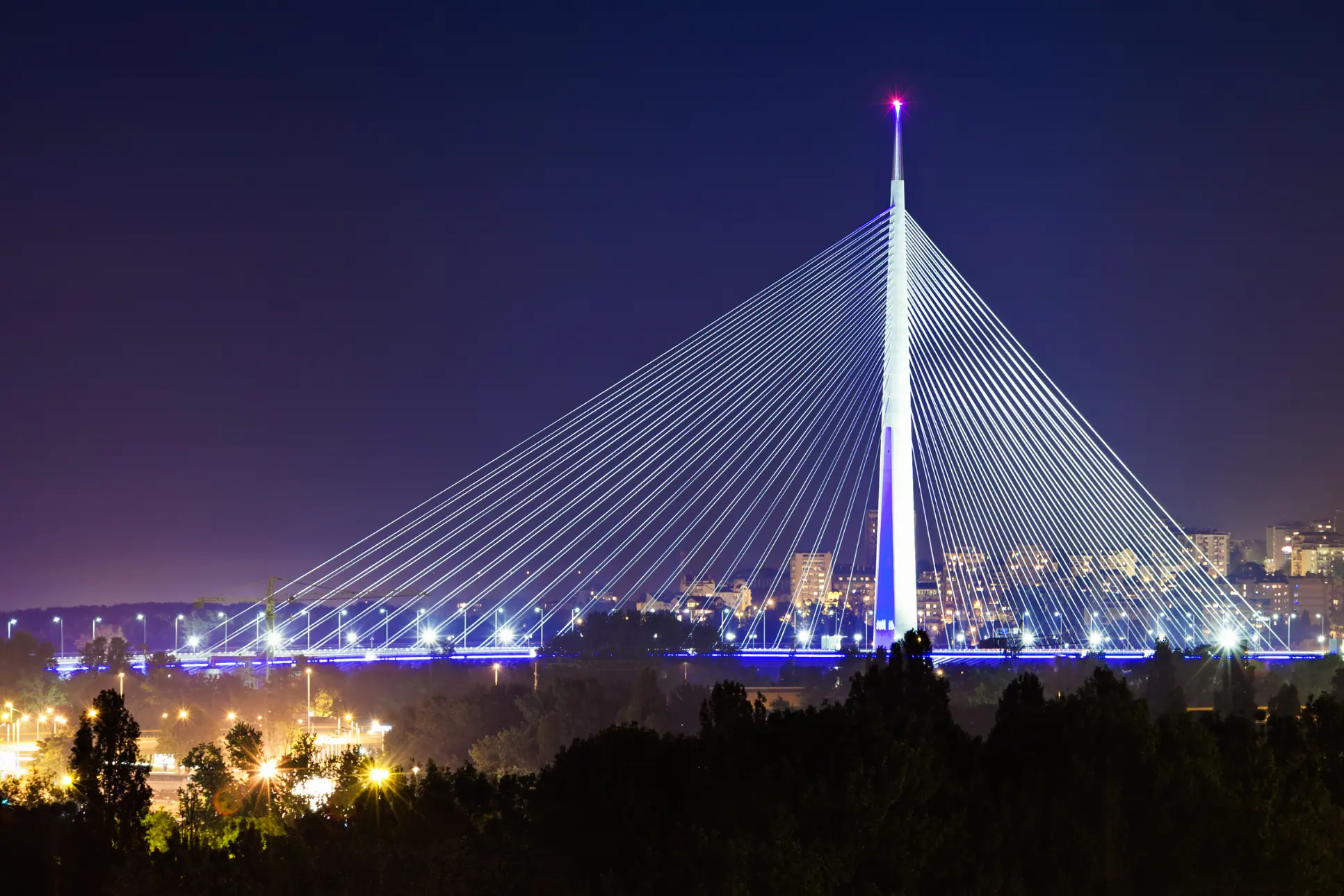 Cable-stayed bridge pylon and cables under an overcast sky